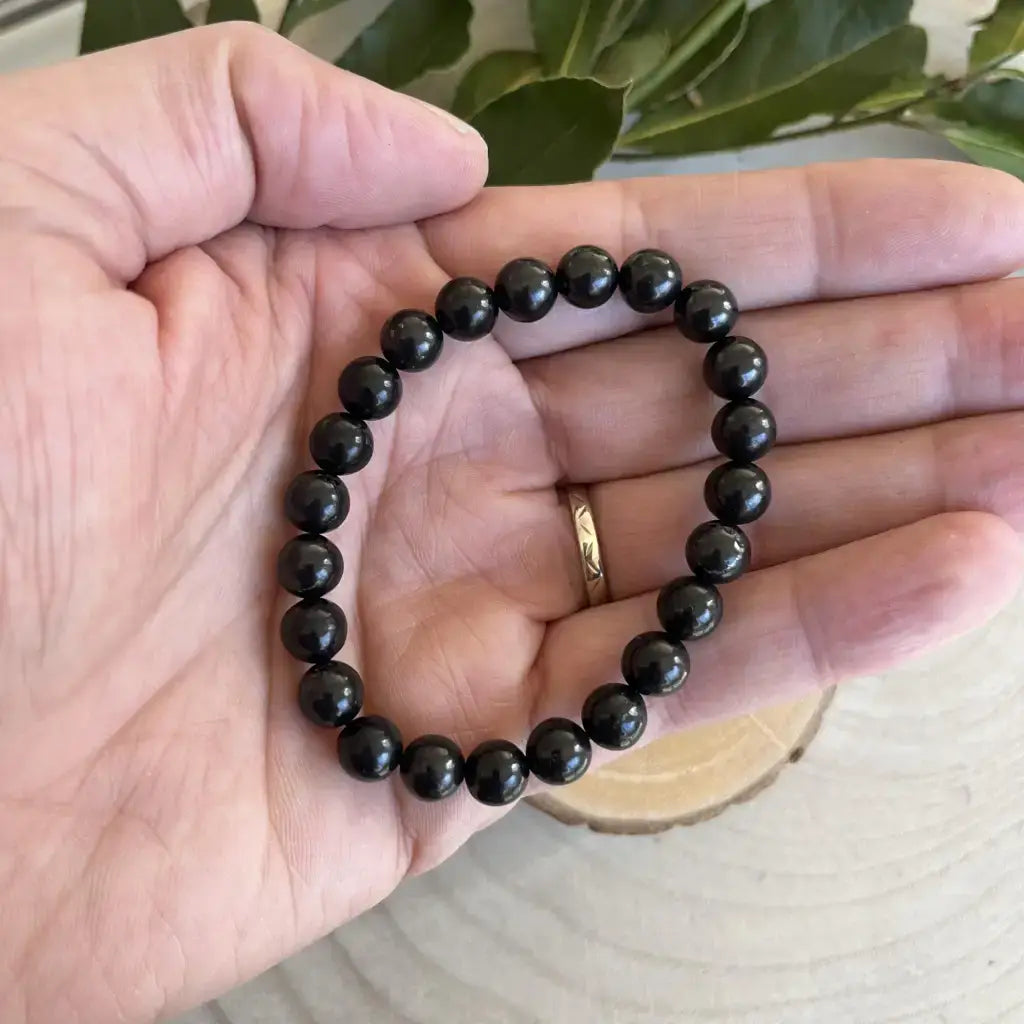 Bracelet Bouclier Shungite en perles noires naturelles, idéal pour protection et bien-être