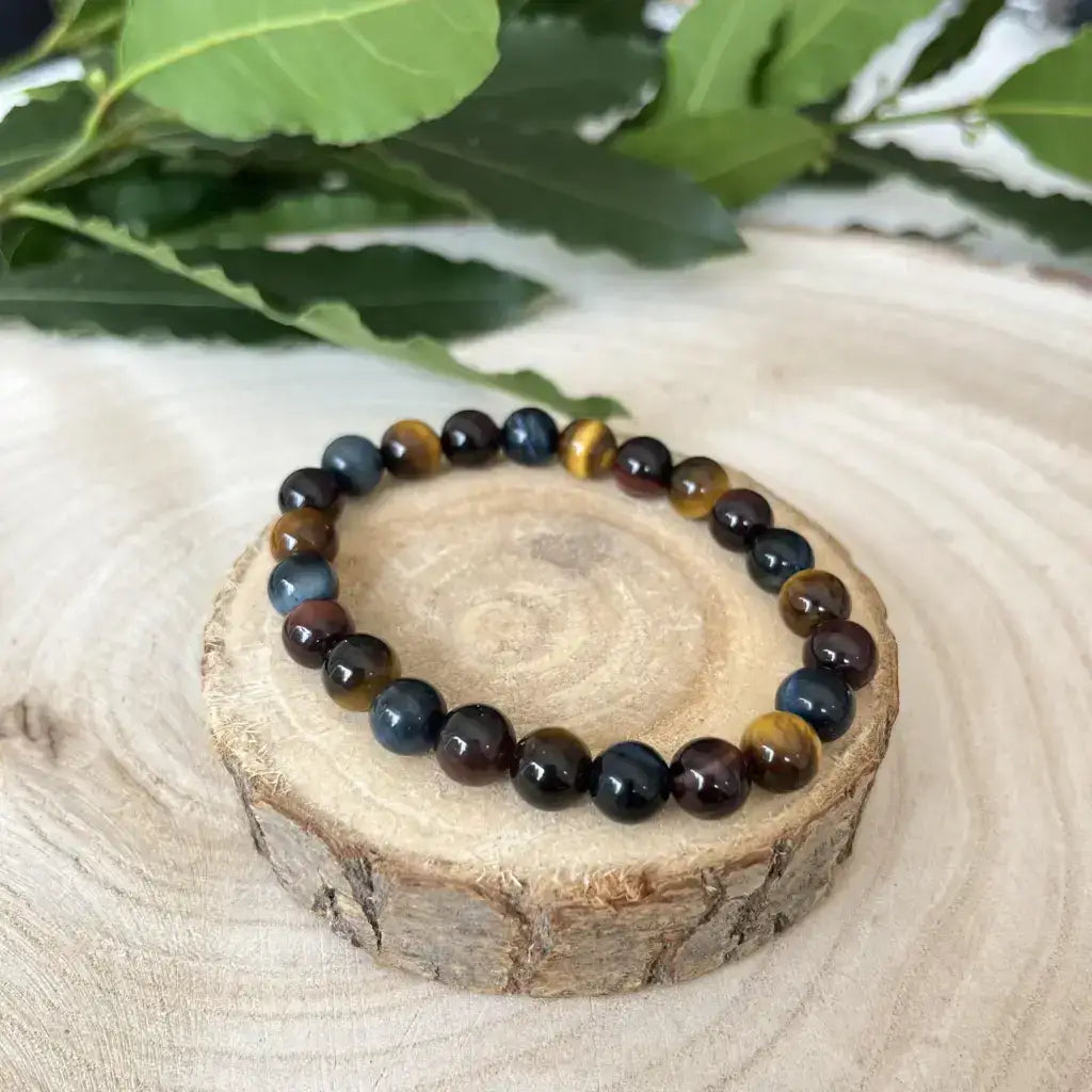 Bracelet Trois Yeux en pierres Oeil de Tigre, Oeil de Taureau et Oeil de Faucon sur support en bois